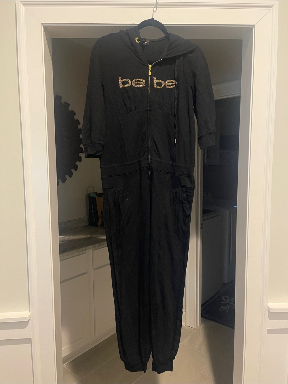 bebe Black Hooded Zip Jumpsuit with Gold Logo